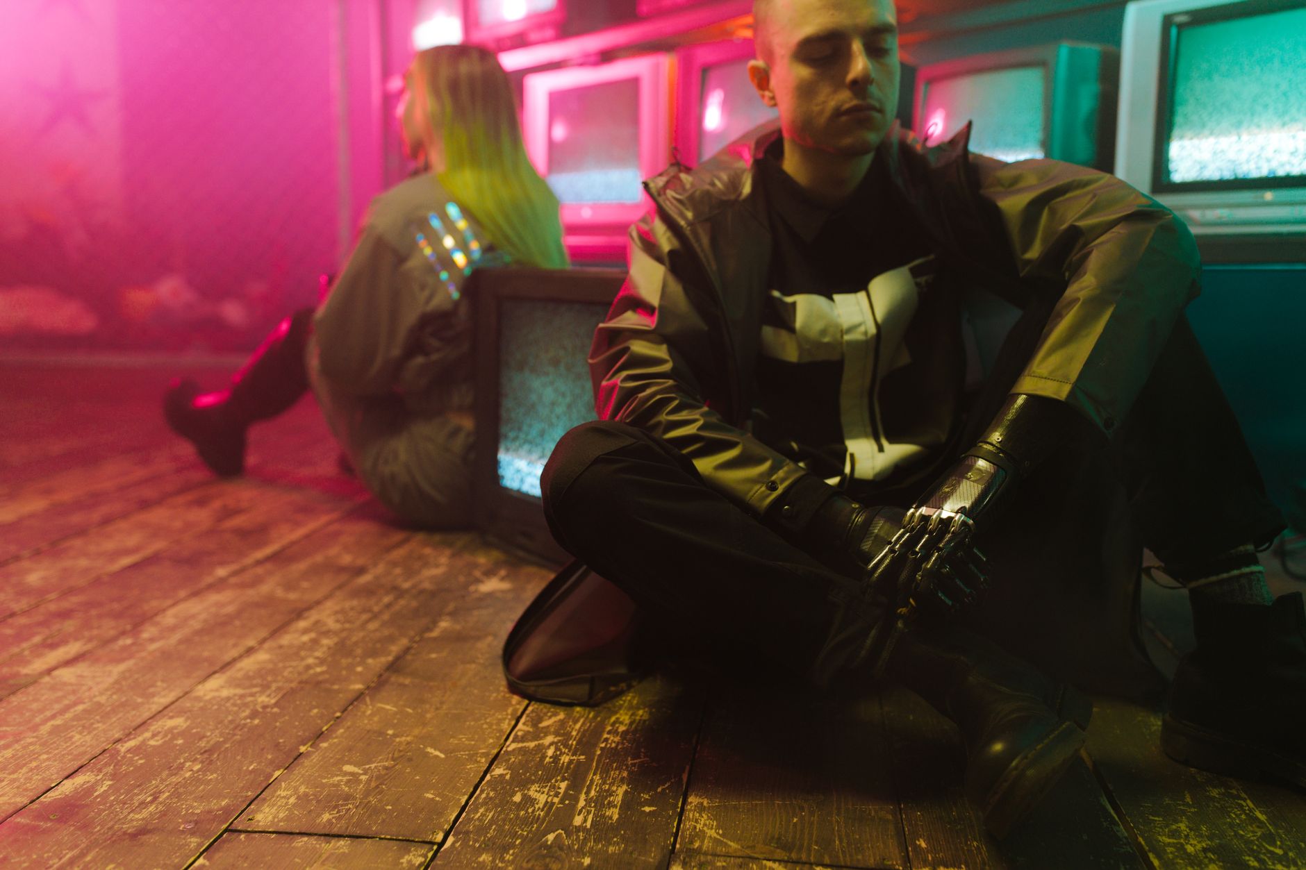 Futuristic urban atmosphere with people in cyberpunk attire and vivid neon lights.