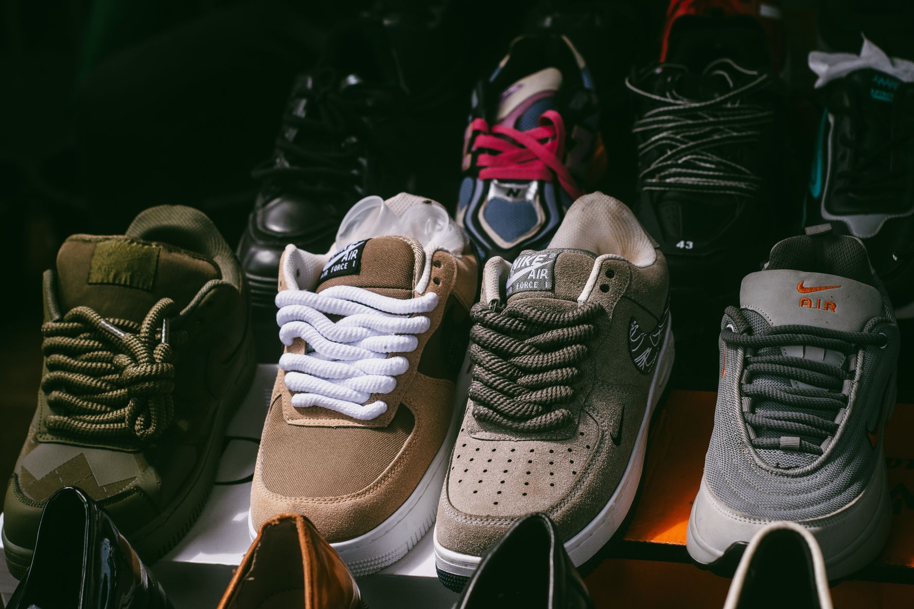 An assortment of various sneakers displayed together, showcasing different styles and colors.